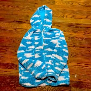 Zip up sweater that has the clouds and the sky detailed on it!